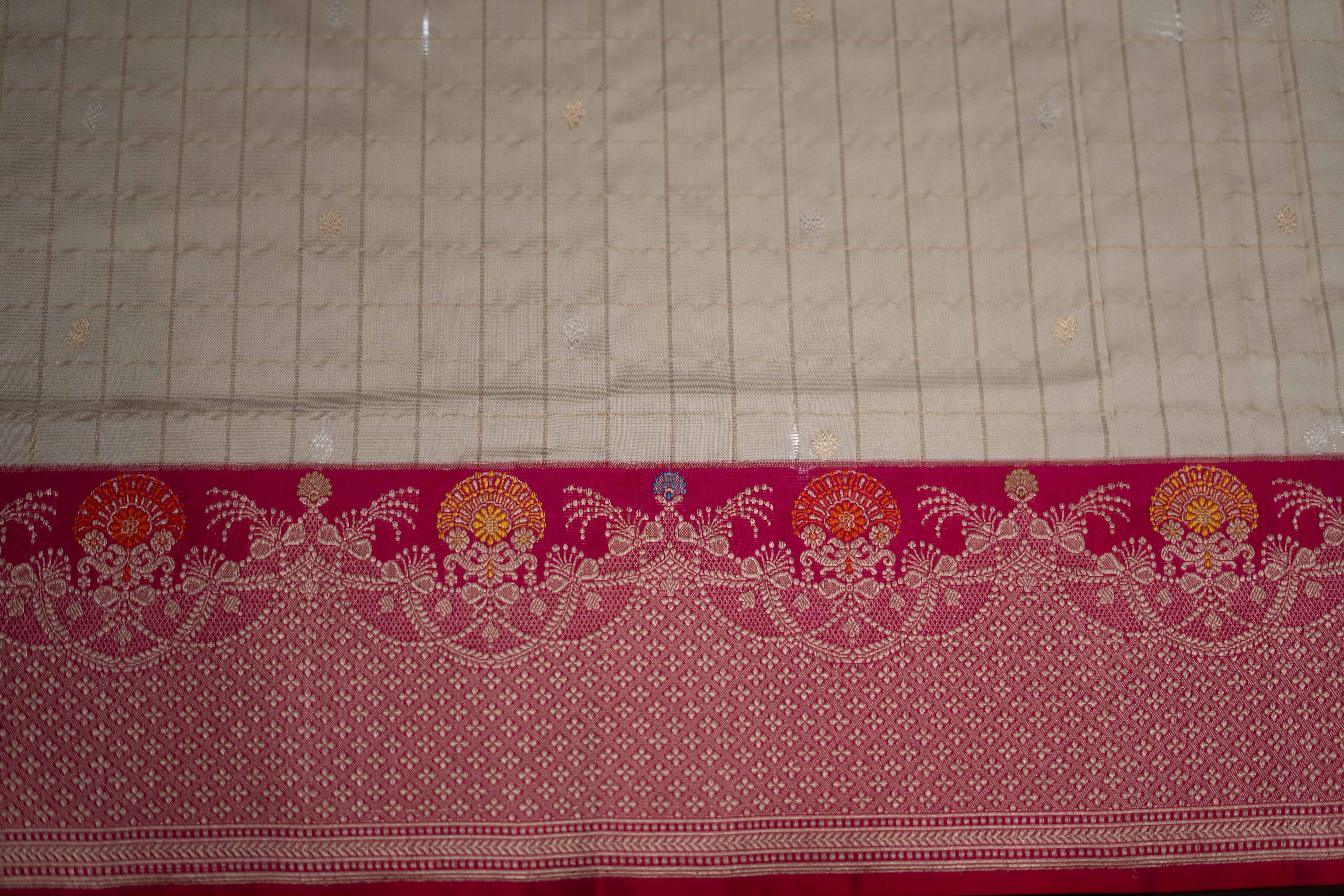 Ivory Banarasi silk saree with zari patterns