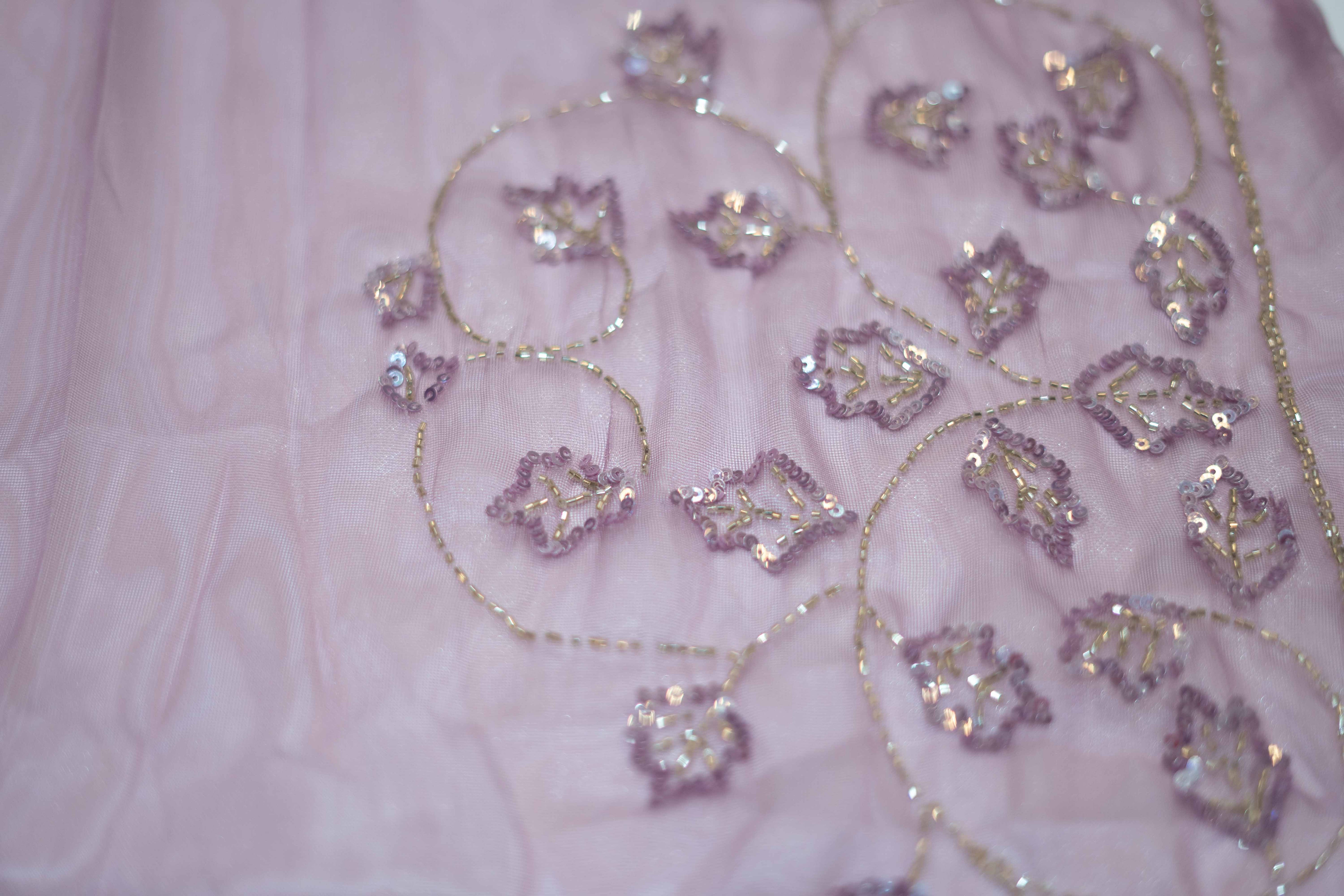Lavender work saree crafted from shimmering organza