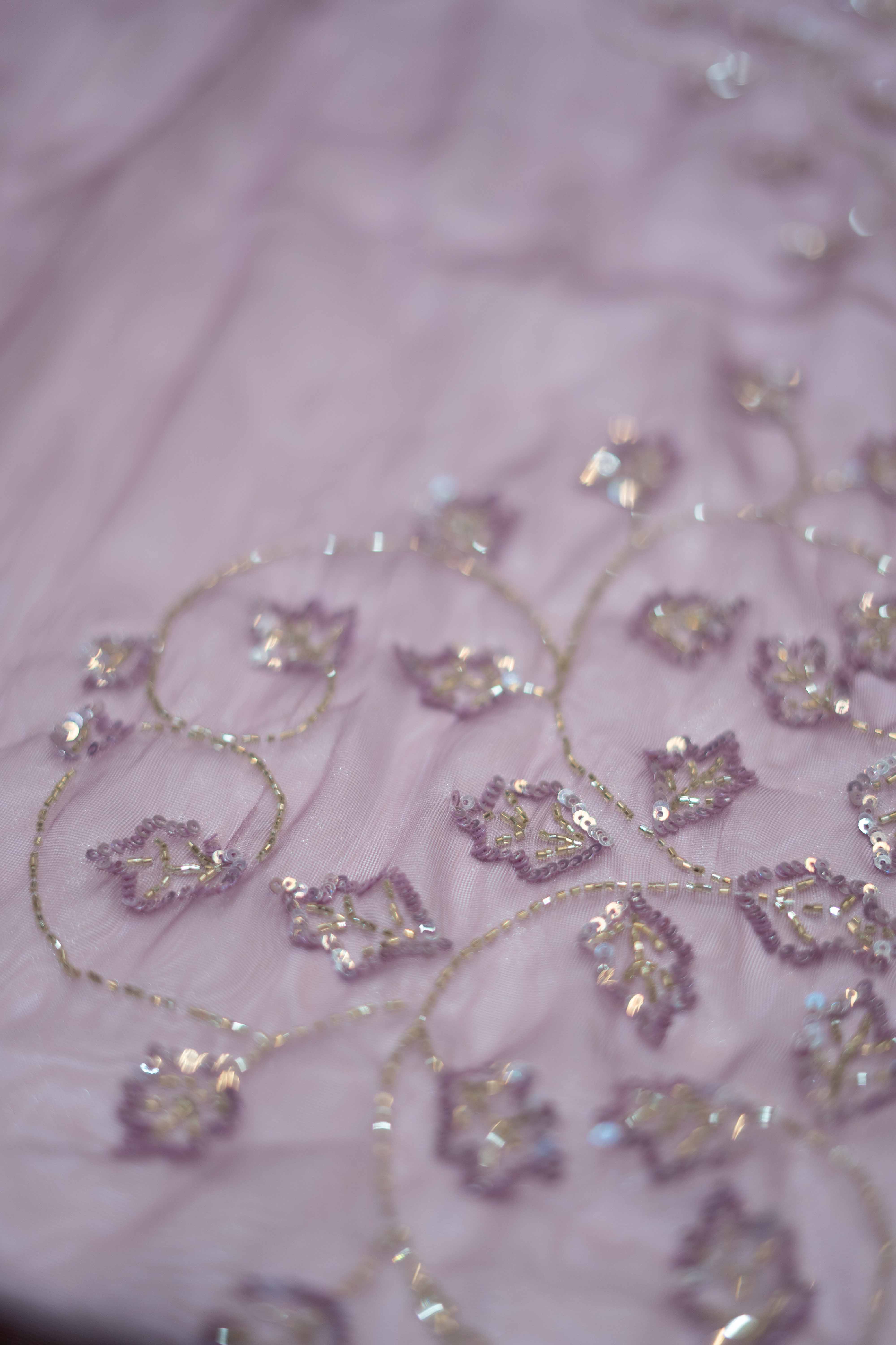 Lavender work saree crafted from shimmering organza