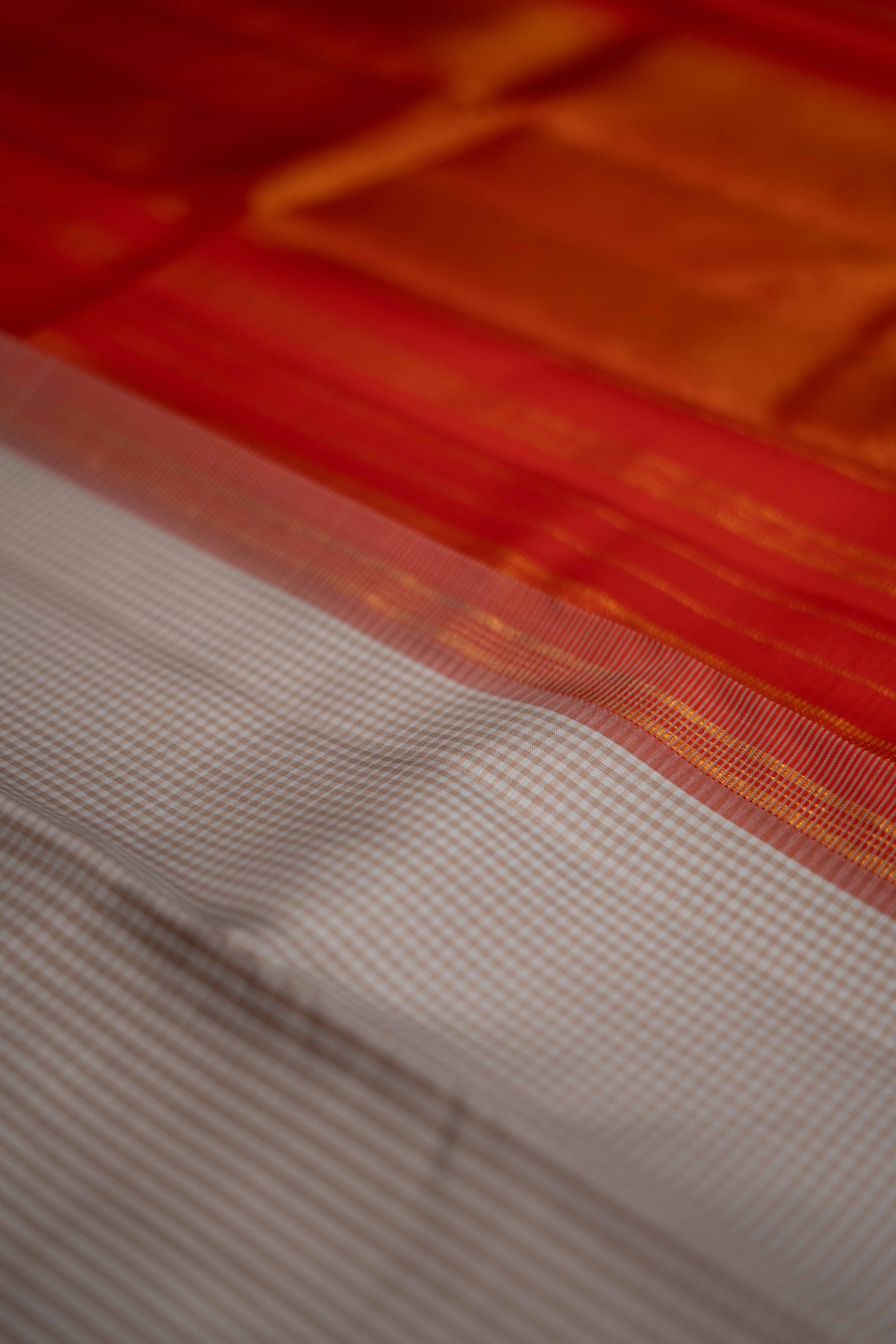 Kanchipuram Silk saree, beautifully woven with intricate zari work.