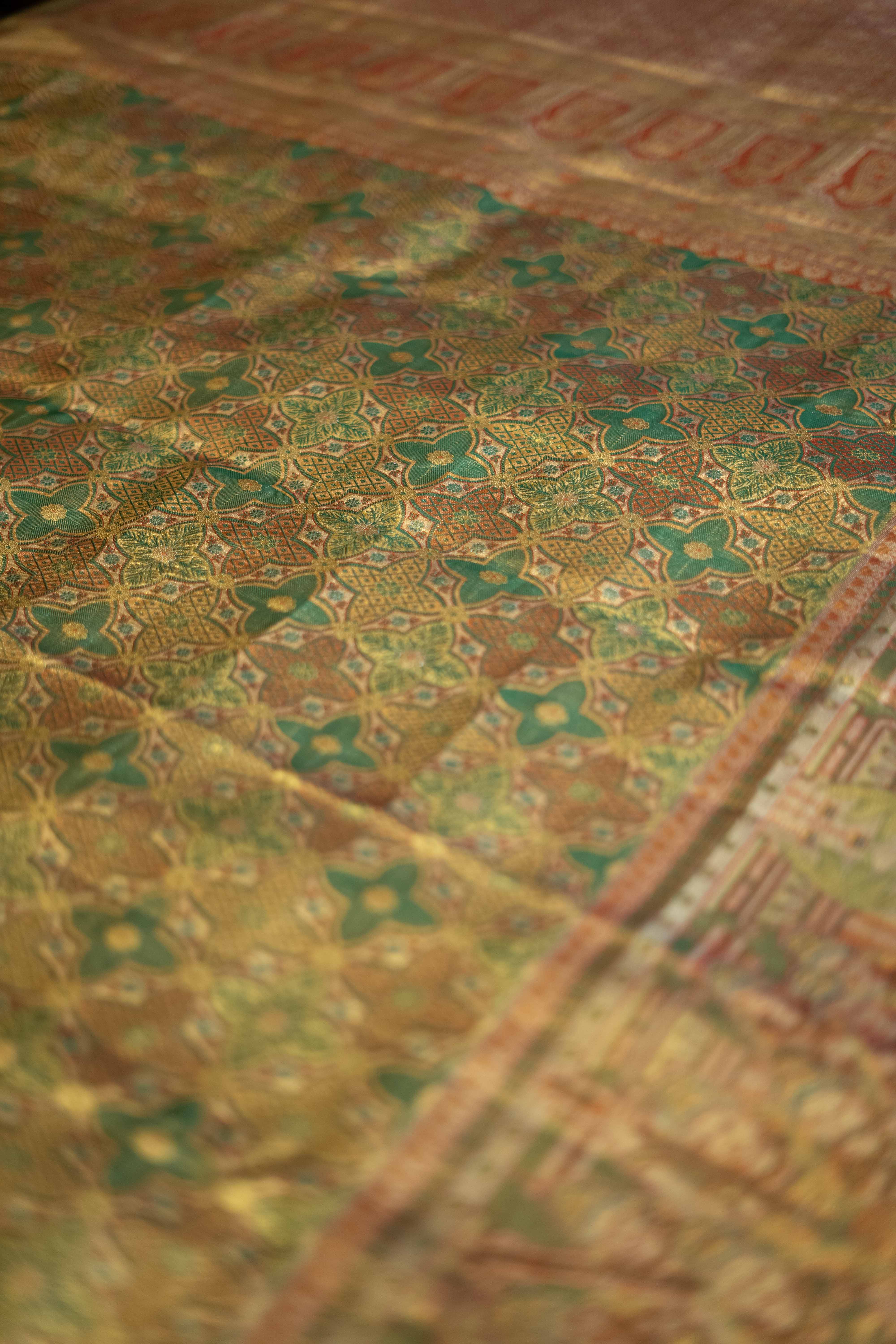 Green Kanchipuram silk saree, adorned with zari
